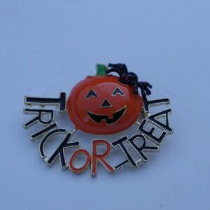 Women`s gold tone trick or treat pumpkin halloween